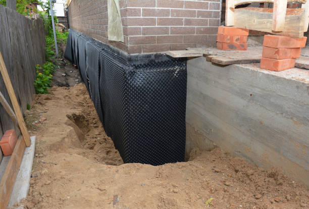Happy homeowners after waterproofing job in Dalton